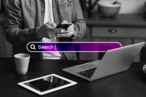 A man sits at his desk, searching online about "Google Local Service Ads for Construction" with intensity. The search tab is highlighted.